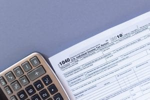 IRS Form 1040 and a Calculator