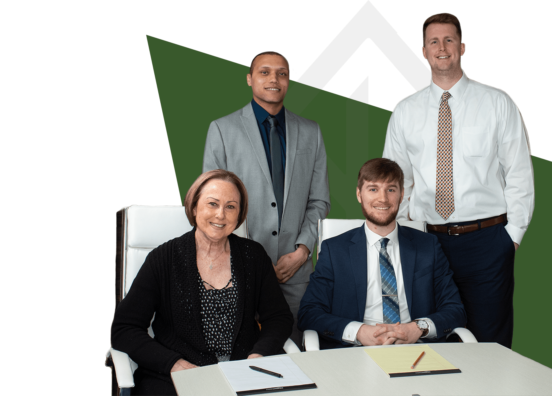 four professionals at a conference table