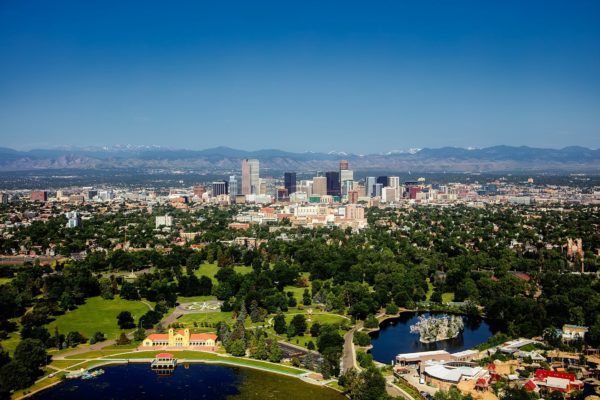 the denver skyline with a mountain backdrop